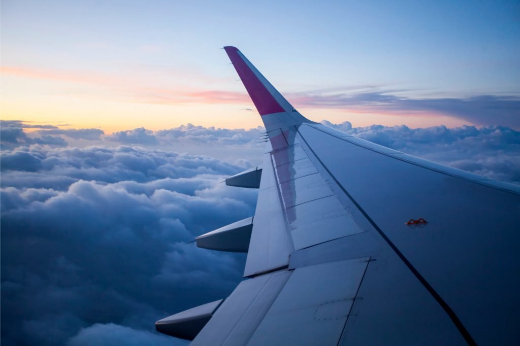 morning-sunrise-with-wing-of-an-airplane-2023-11-27-05-11-12-utc.jpg